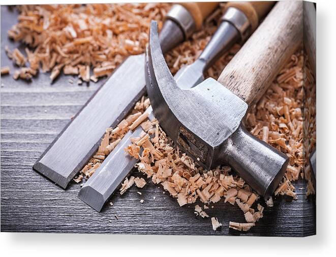 Handle Canvas Print featuring the photograph Close up of claw hammer and metal firmer chisels in by Mihalec