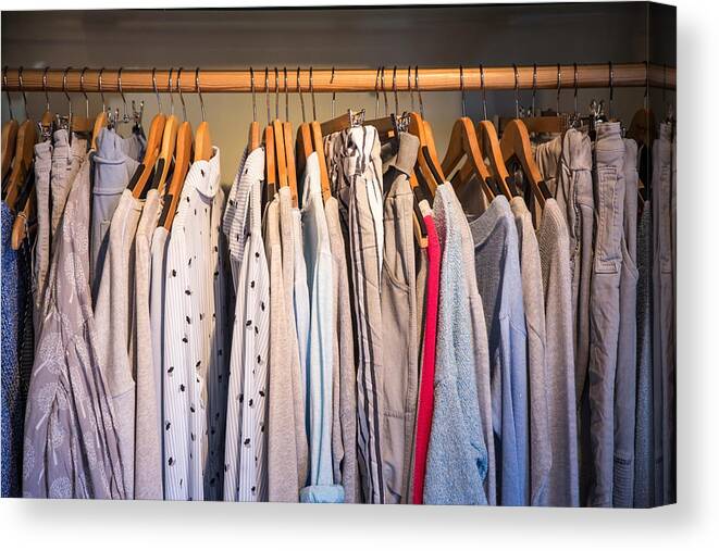 Color Image Canvas Print featuring the photograph Clothes on rail in shop, close-up by Russ Rohde