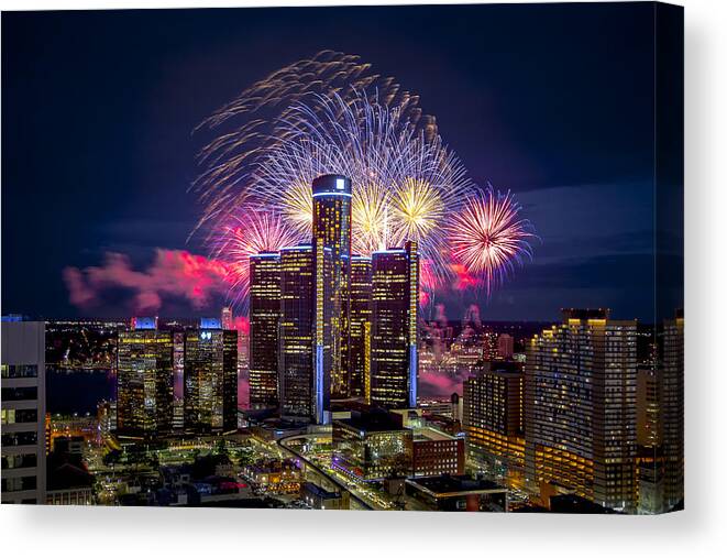 Firework Display Canvas Print featuring the photograph Colorful fireworks in Detroit by Photo by Mike Kline (notkalvin)