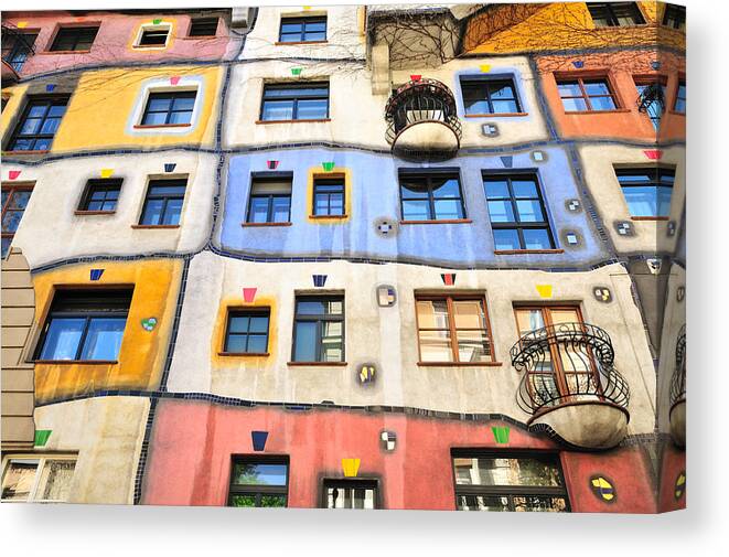 Art Canvas Print featuring the photograph Colourful Facade of the Hundertwasser House, Hundertwasserhaus, Vienna, Austria by GorazdBertalanic