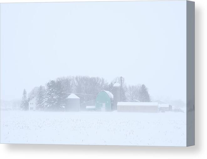 Pastel Canvas Print featuring the photograph Cool Pastels - pastel colored farm buildings in a Wisconsin snowstorm by Peter Herman