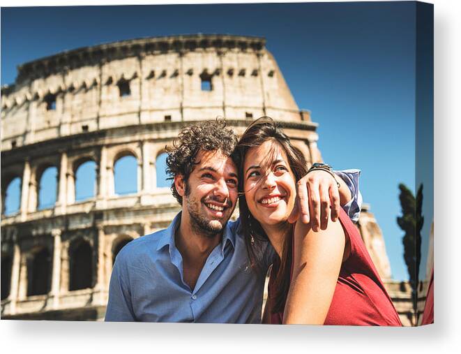Young Men Canvas Print featuring the photograph Couple Of Tourist In Rome Enjoy The Vacation by Franckreporter