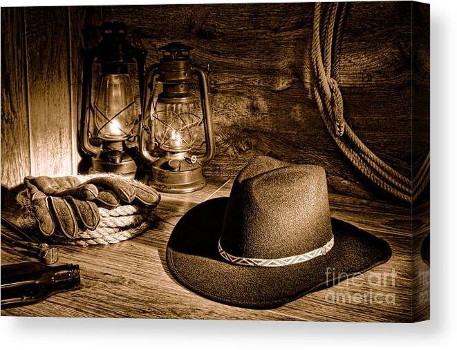 Western Canvas Print featuring the photograph Cowboy Hat and Kerosene Lanterns - Sepia by Olivier Le Queinec