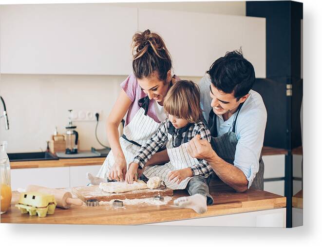 Domestic Room Canvas Print featuring the photograph Cutting cookie forms with mom and dad by Pixelfit
