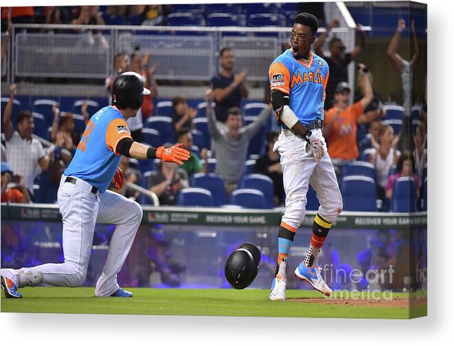 People Canvas Print featuring the photograph Dee Gordon and Christian Yelich by Eric Espada