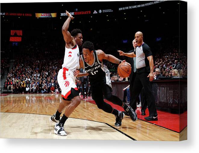 Demar Derozan Canvas Print featuring the photograph Demar Derozan and Kyle Lowry by Mark Blinch