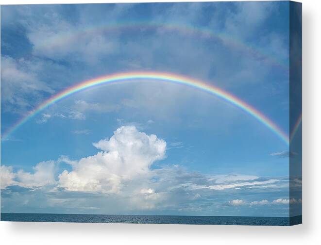 Rainbow Canvas Print featuring the photograph Double rainbow at sea by Bradford Martin