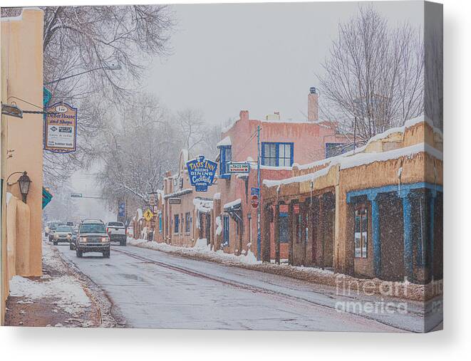 Taos Canvas Print featuring the photograph Downtown Taos while snowing by Elijah Rael