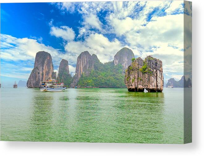 Archipelago Canvas Print featuring the photograph Dreamy scenic among the rocks of Halong Bay by HuyThoai