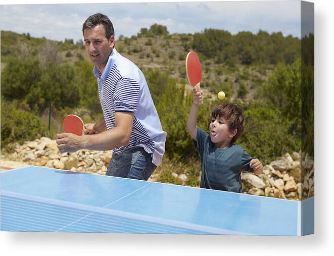 4-5 Years Canvas Print featuring the photograph Father and son playing table tennis by Frank and Helena