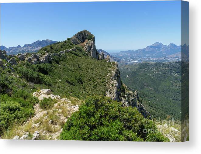 Mountain Canvas Print featuring the photograph Ferrer mountain ridge and view of Puig Campana by Adriana Mueller