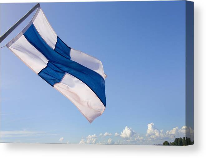 Wind Canvas Print featuring the photograph Finnish national flag by Keren Su