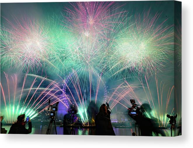 Fireworks Canvas Print featuring the photograph Fireworks at New years Eve by Andrew Lalchan