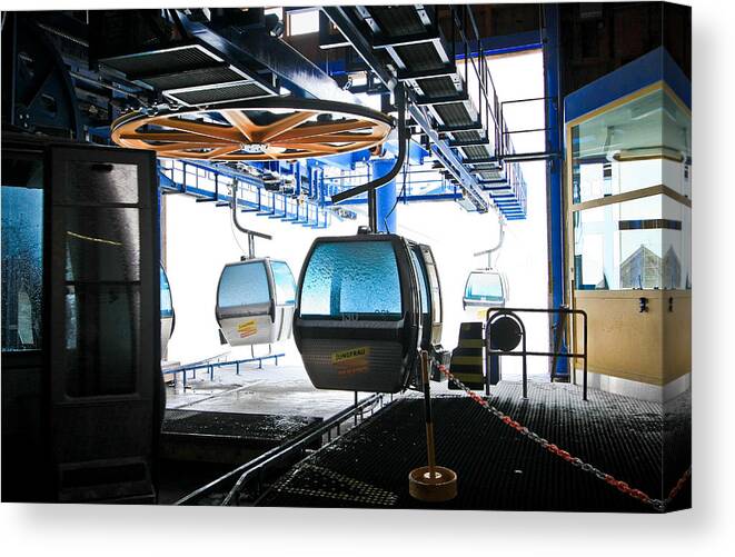 Cable Cars Canvas Print featuring the photograph First Cableway Top Station with Blizzard Outside by Steve Ember