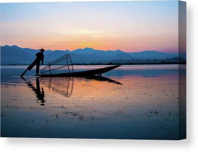 Fisherman Canvas Print featuring the photograph Fisherman at Inle Lake by Arj Munoz