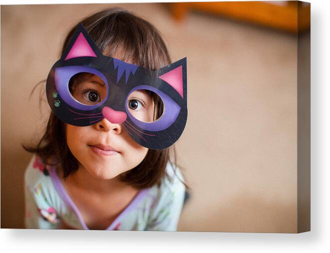Child Canvas Print featuring the photograph Girl wearing cat mask by Laura Olivas