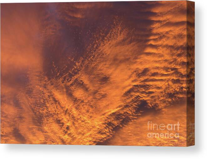 Clouds Canvas Print featuring the photograph Glowing sunset sky with deep orange clouds by Adriana Mueller