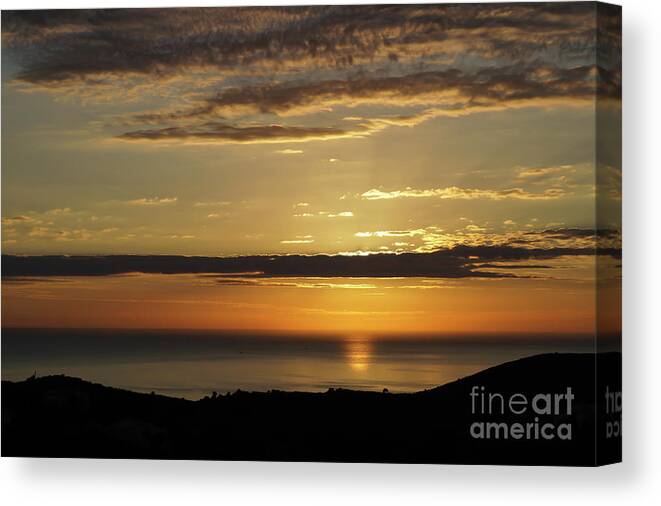Clouds Canvas Print featuring the photograph Golden sunrise over the sea by Adriana Mueller