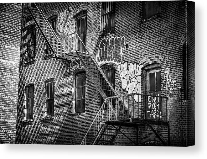 Graffiti Canvas Print featuring the photograph Graffiti and Fire Escapes by Penny Polakoff