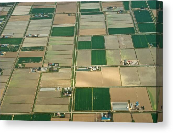 Hokkaido Canvas Print featuring the photograph Green fields in Naganuma town in Hokkaido daytime aerial view from airplane by Taro Hama @ e-kamakura