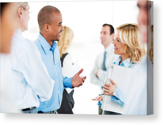 People Canvas Print featuring the photograph Group of successful businesspeople standing and talking. by Skynesher