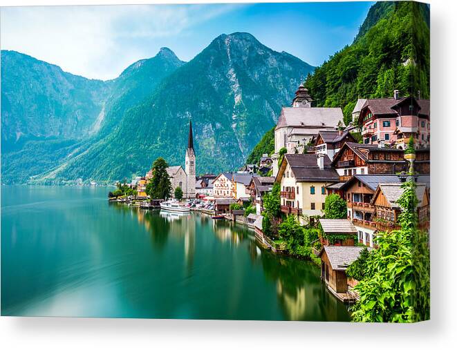 Water's Edge Canvas Print featuring the photograph Hallstatt Village and Hallstatter See lake in Austria by Chunyip Wong