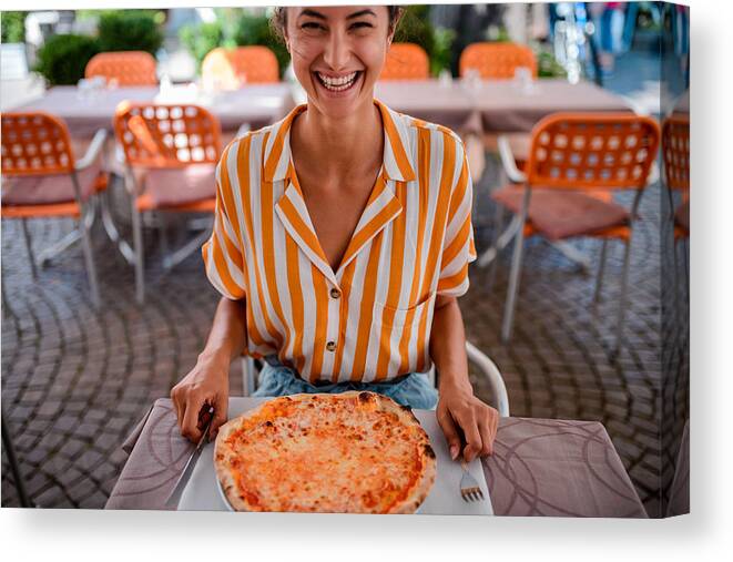 Sweater Canvas Print featuring the photograph Happy woman eating pizza. by MStudioImages