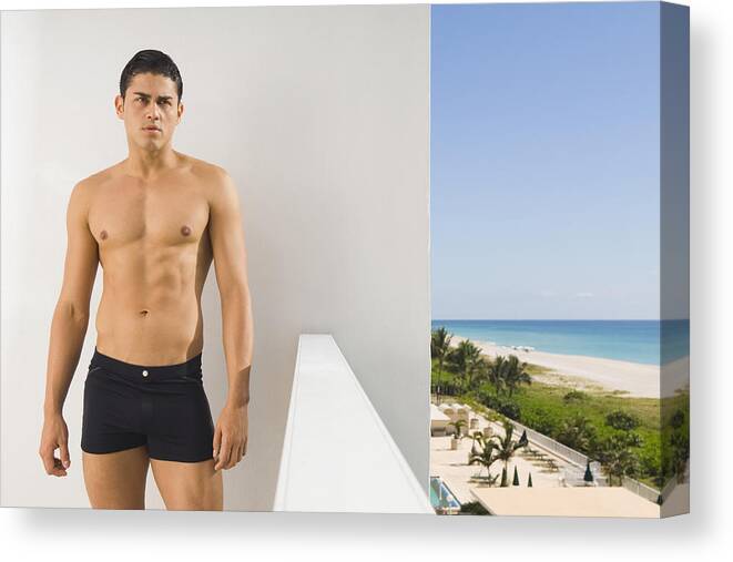 Three Quarter Length Canvas Print featuring the photograph Hispanic man in bathing suit on balcony by PBNJ Productions