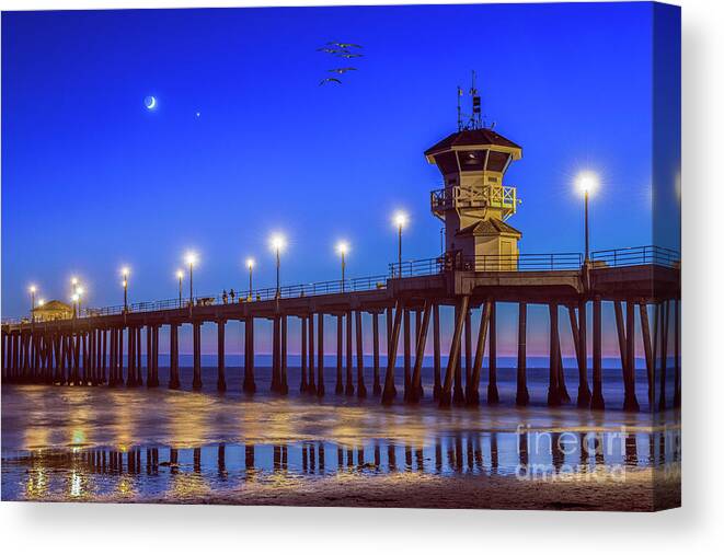 Huntington Beach Canvas Print featuring the photograph Huntington Beach Pier Night Moon by David Zanzinger