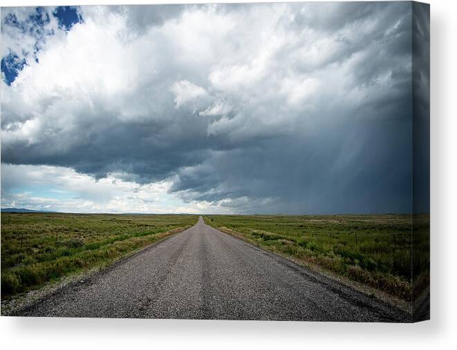 Storm Canvas Print featuring the photograph Idaho Stormy Road by Wesley Aston