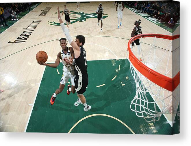 Bennedict Mathurin Canvas Print featuring the photograph Indiana Pacers v Milwaukee Bucks by Gary Dineen