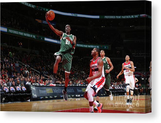 Nba Pro Basketball Canvas Print featuring the photograph John Wall and Tony Snell by Ned Dishman