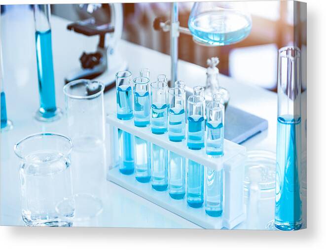 Medical Research Canvas Print featuring the photograph Laboratory test tubes and solution with stethoscope background. Science and Medical concept. Scientist research and analysis biotechnology concept by Shutter2U
