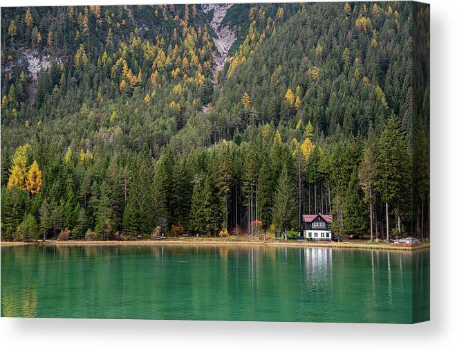 Italy Canvas Print featuring the photograph House in the lake and forest. Lago di dobbiaco lake. Italian aps by Michalakis Ppalis