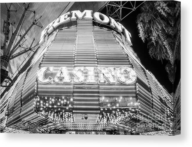 America Canvas Print featuring the photograph Las Vegas Fremont Casino Sign at Night Black and White Photo by Paul Velgos