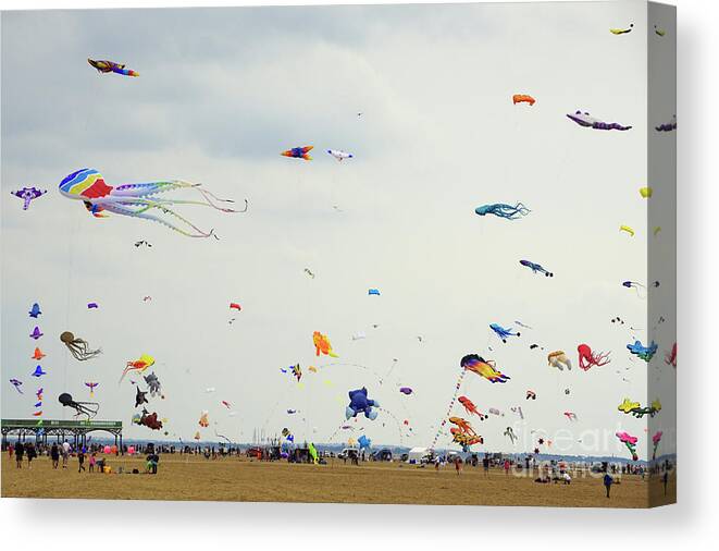Flying Canvas Print featuring the photograph Let's go fly a kite by David Birchall