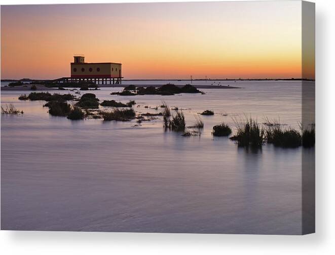 Algarve Canvas Print featuring the photograph Lifesavers building at dusk in Fuzeta. Portugal by Angelo DeVal