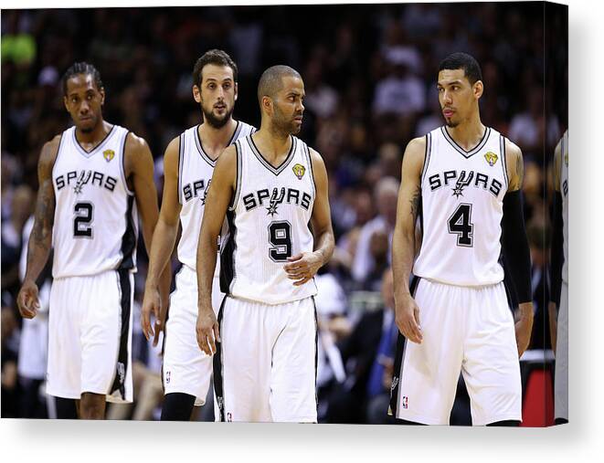 Following Canvas Print featuring the photograph Marco Belinelli, Kawhi Leonard, and Danny Green by Andy Lyons
