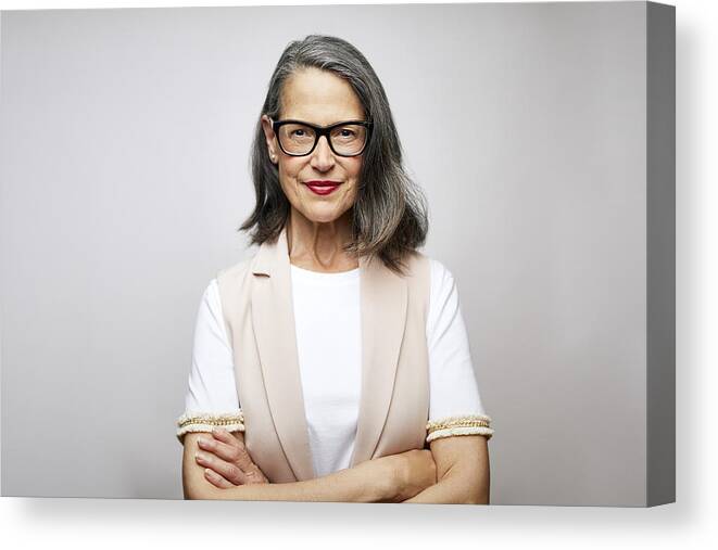 Expertise Canvas Print featuring the photograph Mature female CEO with arms crossed by Morsa Images