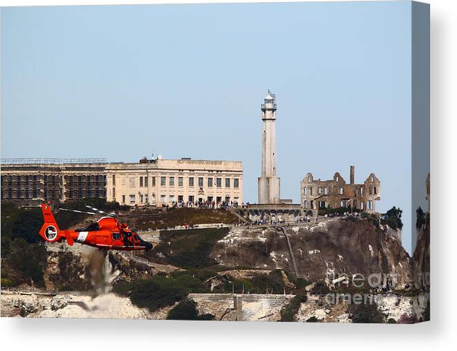 Rescue Helicopter Canvas Print featuring the photograph MH-65 D/E Dolphin in Action in SF Bay by fototaker Tony