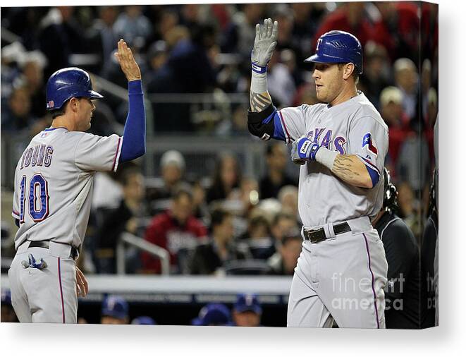 Playoffs Canvas Print featuring the photograph Michael Young and Josh Hamilton by Al Bello