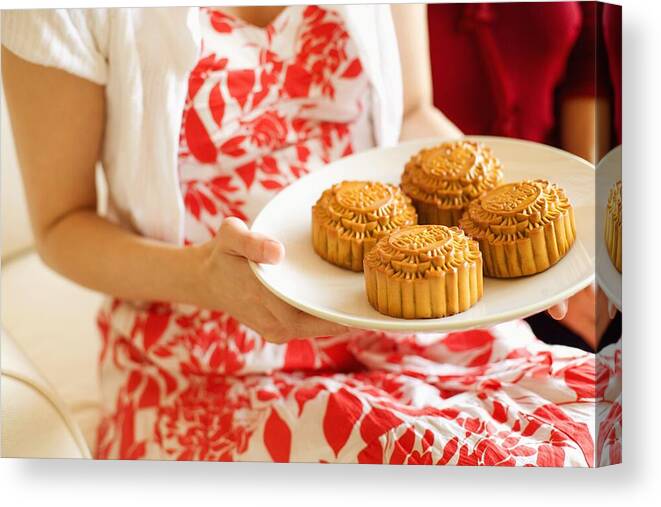 Casual Clothing Canvas Print featuring the photograph Mid section view of a woman holding a plate of cake by Red Chopsticks