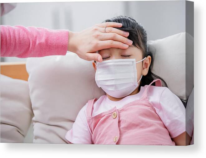Pandemic Canvas Print featuring the photograph Mom touch kid to check her fever by RyanKing999