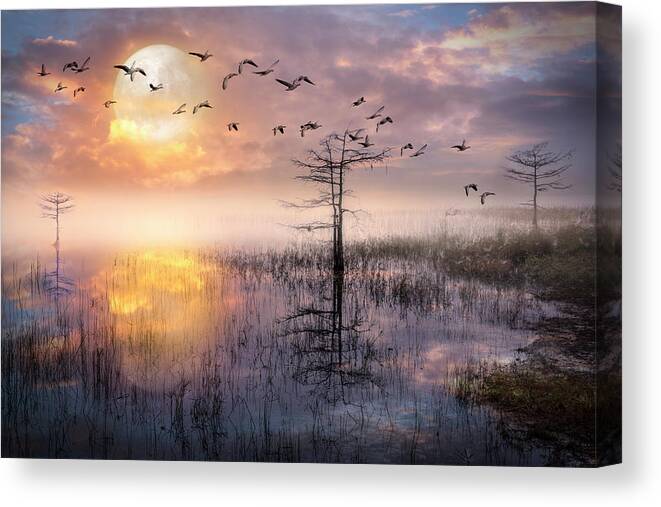 Birds Canvas Print featuring the photograph Moon Rise Flight by Debra and Dave Vanderlaan