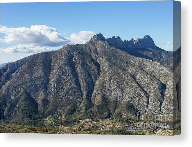 Mountain Landscape Canvas Print featuring the photograph Sierra de Bernia mountain ridge and clouds by Adriana Mueller