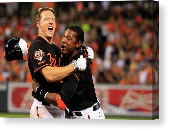 American League Baseball Canvas Print featuring the photograph Nick Hundley and Adam Jones by Rob Carr