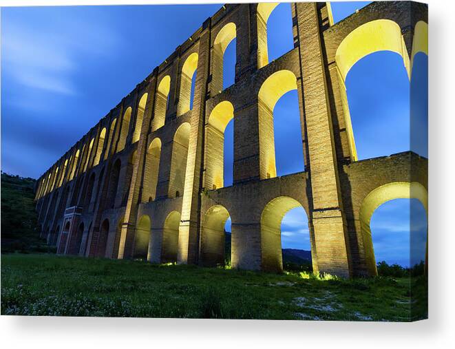 Landscape Canvas Print featuring the photograph Old aqueduct by Umberto Barone