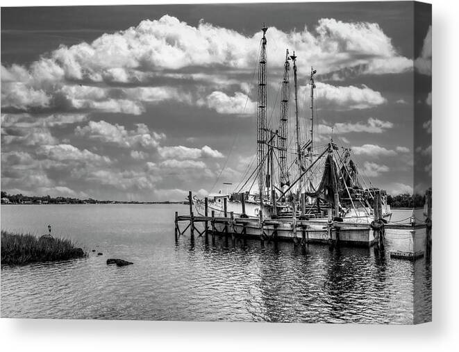 Boats Canvas Print featuring the photograph Old Shrimp Boats in the Harbor Black and White by Debra and Dave Vanderlaan