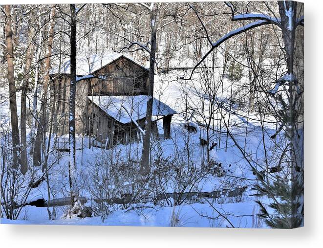Barn Canvas Print featuring the photograph An Old Brown Barn in Snow by Kim Bemis