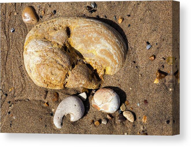 United Kingdom Canvas Print featuring the photograph Pebbles at Low Tide by Richard Donovan